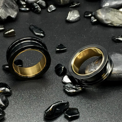 Black Steel Ear Tunnels accented with Gold