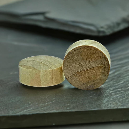 A pair of plugs made from crocodile wood