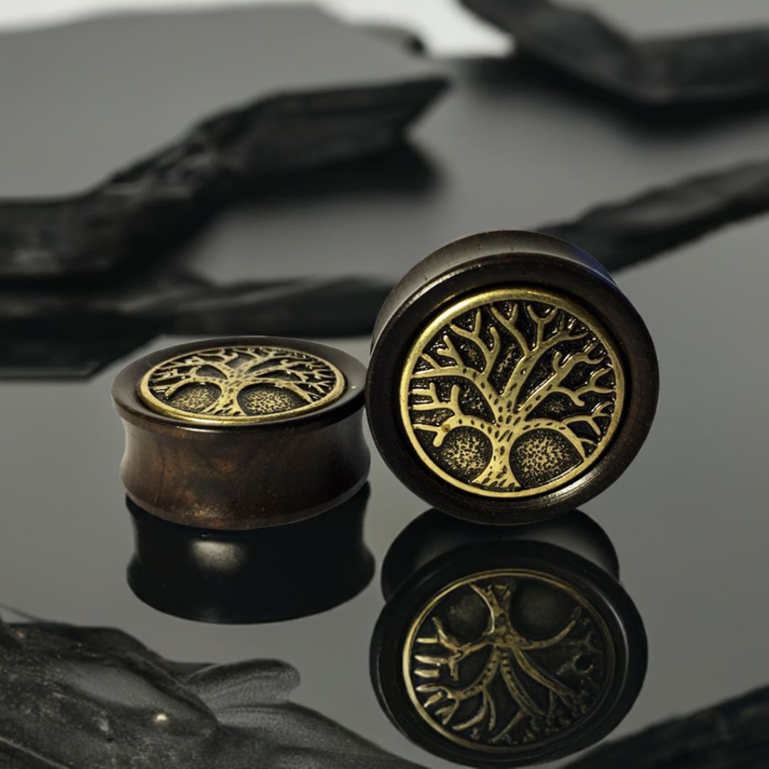 Wood Gauges for stretched ears featuring a tree of life design